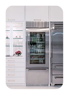 Bright kitchen renovation in San Diego featuring chef-style stainless steel appliances and a double-door refrigerator.