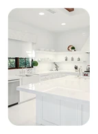 Bright kitchen renovation with a large white island and custom cabinetry.